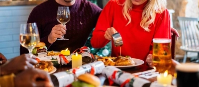 a group of people eating at the table