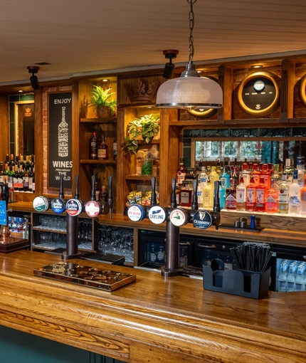 The interior bar area with hanging pendant lighting at The Church View Inn.