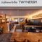 Interior dining area of a pub with a bar.