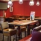 Interior dining area of a pub with a TV.