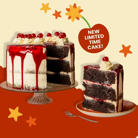 A banner showing the new Choc-N-Cherry Bomb cake served on a glass cake stand and topped with whipped cream or piped icing, cherries, and a red sauce which drips down the sides of the cake. The banner also shows an image of a slice of the cake served on a plate, below the words "New limited time cake!"; and the images are surrounded by yellow and orange stars.