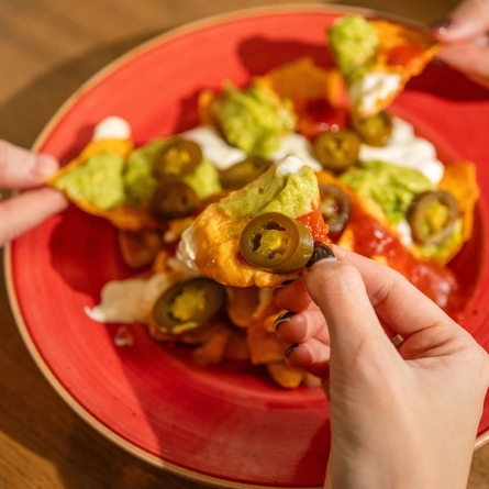 A served side of Nachos being enjoyed by customers at Hungry Horse venues.