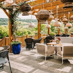 exterior beer garden of a pub with a seating area