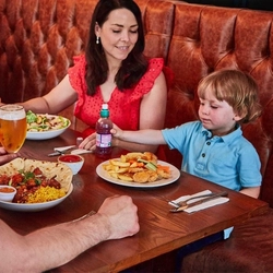 A family enjoying a meal at a Pub & Carvery