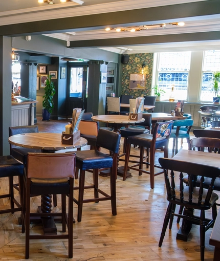 The interior bar and restaurant seating area at The Hare & Hounds.