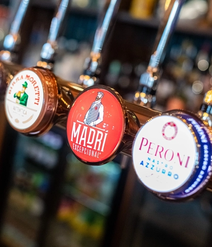 The interior bar focusing on various pumps at The Wheatsheaf.