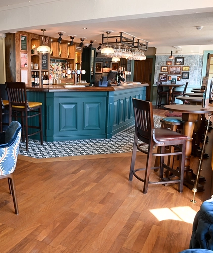The interior bar and restaurant seating area with electronic pub game at The Yorkshire Grey.