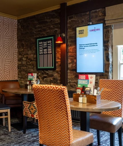 The interior restaurant and seating area with TV at the Man of Gwent.