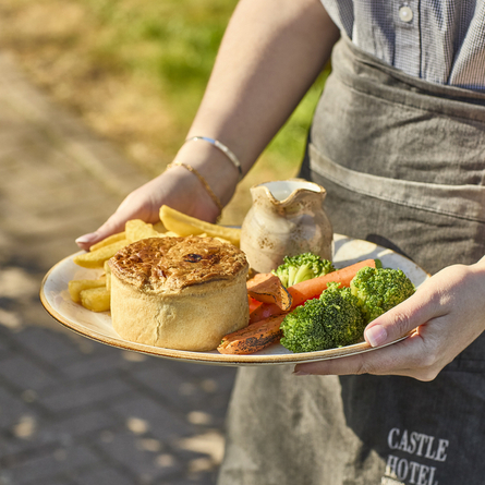 An image showing the British slow cooked steak and ale pie at Chef & Brewer.