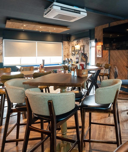 The restaurant area of the Cocked Hat, with a TV on the wall.