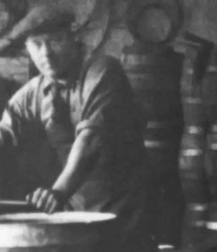 A black and white photograph showing brewers in our brewery