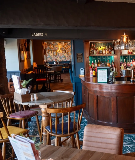 Interior of the restaurant showing a seating area and bar