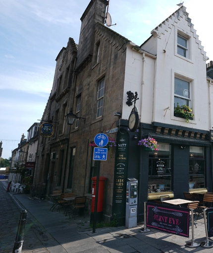 External view of a pub entrance and outdoor searing area