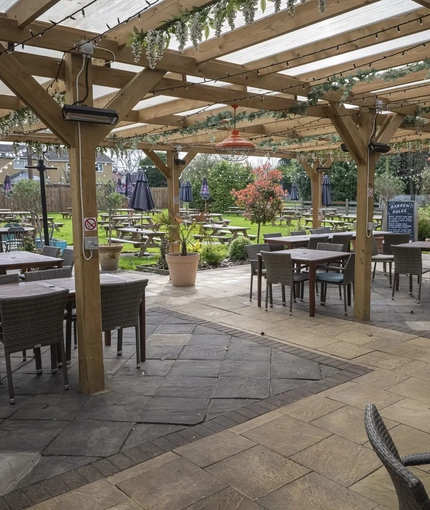 exterior beer garden with seating area
