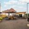 The exterior beer garden seating area at the Counting House, with large shade umbrellas, an under cover section, and an accessibility ramp.