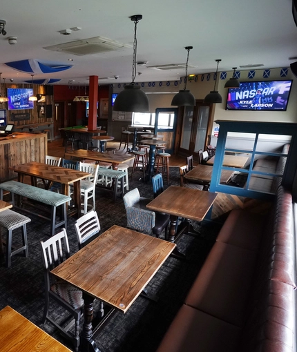 interior of the restaurant with seating area and bar