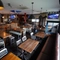 interior of the restaurant with seating area and bar