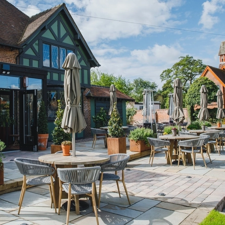 The exterior beer garden seating area with the rear of the venue at The Boat.