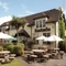 exterior facade of a pub with a seating area