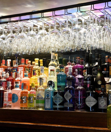 Spirits bottles behind bar
