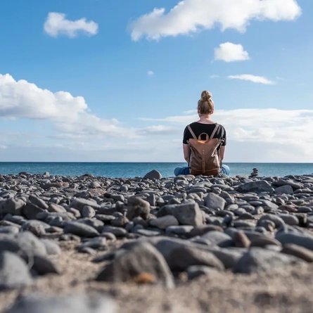 A woman sat on the beach