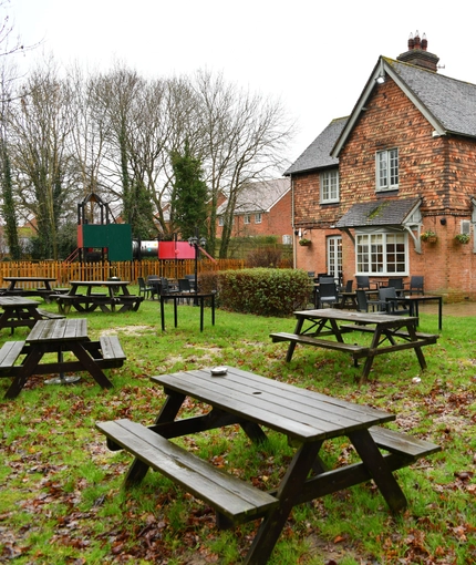 exterior beer garden of a pub with a seating area