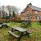 exterior beer garden of a pub with a seating area