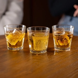 A few glasses of Bombs on a wooden table of a pub