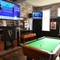 interior seating area with tv and pool table