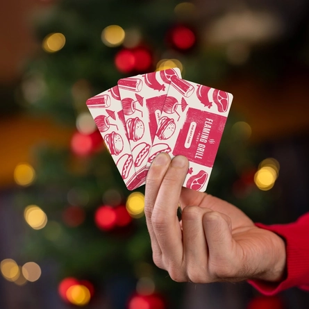 An interior shot of a Christmas Gift Card set for Flaming Grill venues.