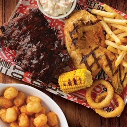 Steak, chips, peas, beef ribs, chicken leg, sweetcorn, cooked from the grill served at Flaming Grill.