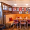 The interior restaurant seating area with feature fireplace at The Durell Arms.