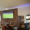 The interior restaurant and seating area with TV at the Snipe.