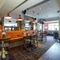Interior dining area of a pub with a TV.