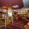 Interior dining area of a pub with a bar.