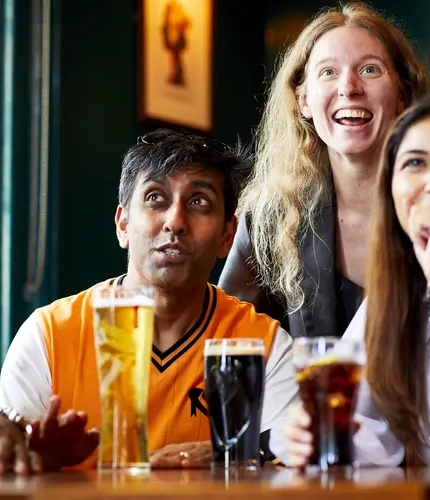 Guests watching live sport at the pub