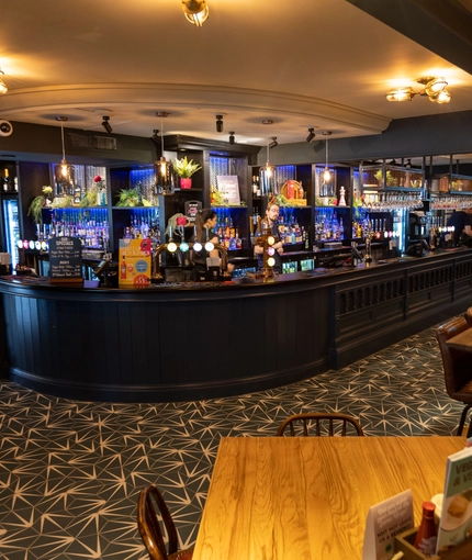 interior bar with seating area and restaurant