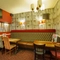 Interior dining area of a pub with a TV.