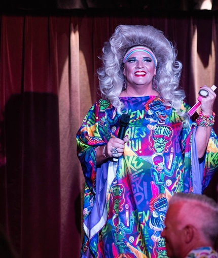 An interior image of one of the drag queen performers on the live event stage entertaining crowds during Pride Weekend at The City Of Quebec.