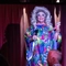 An interior image of one of the drag queen performers on the live event stage entertaining crowds during Pride Weekend at The City Of Quebec.