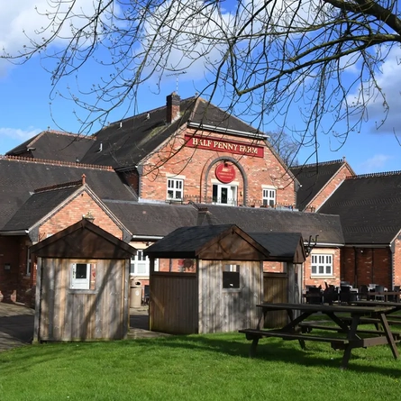 Exterior beer garden of a pub with a seating area.