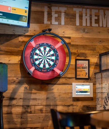 The interior pub games area with dart board at the Man of Gwent.
