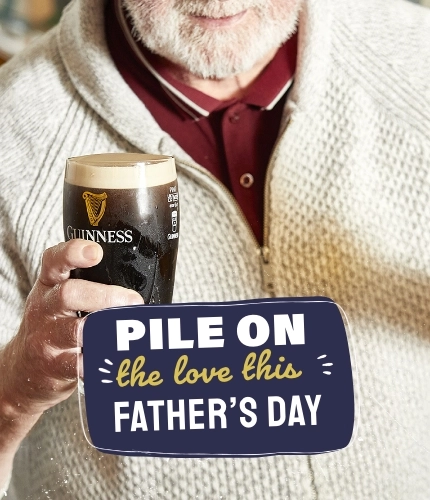 A man with a pint of Guinness and a pint of Birra Moretti