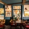 The interior restaurant and seating area next to two large windows at the Three Jolly Butchers.