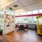 Interior dining area of a pub with claw machines.