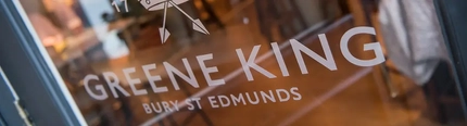 The Greene King logo on a door