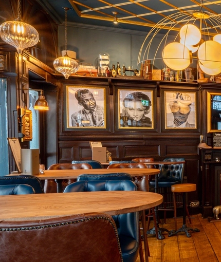 The interior bar and restaurant seating area with feature fireplace at The Blue Posts.