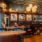 The interior bar and restaurant seating area with feature fireplace at The Blue Posts.