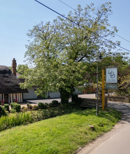 The outside of the Three Horse Shoes, as seen from the road.
