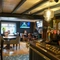 An interior shot of the bar, seating area & TV at the Sitwell Arms in Whiston.